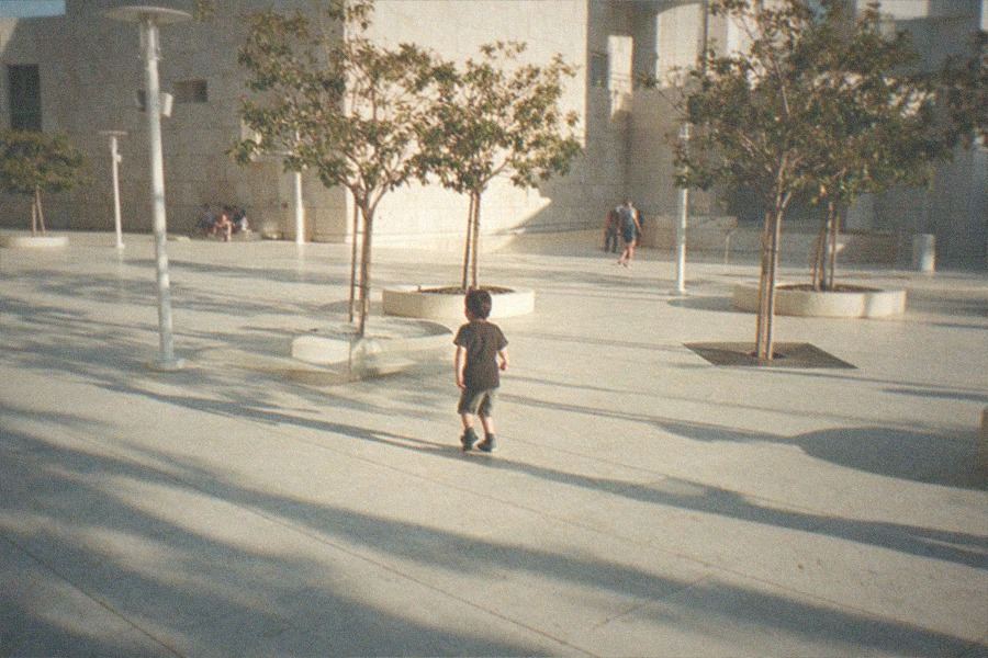 The reflective exterior of a gallery building at the Los Angeles County Museum of Art under afternoon light