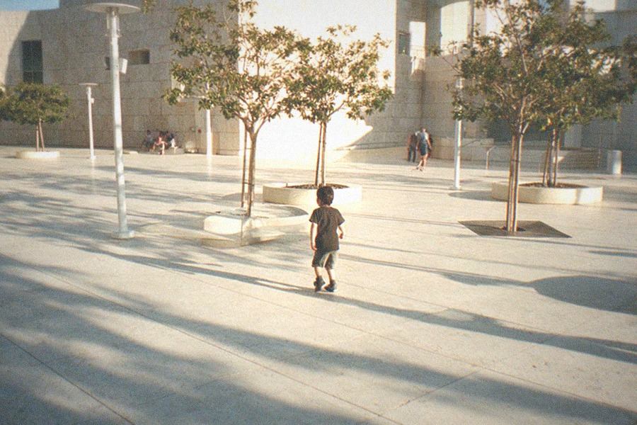 Adobe-style plaza buildings with a historic church facade in warm afternoon light